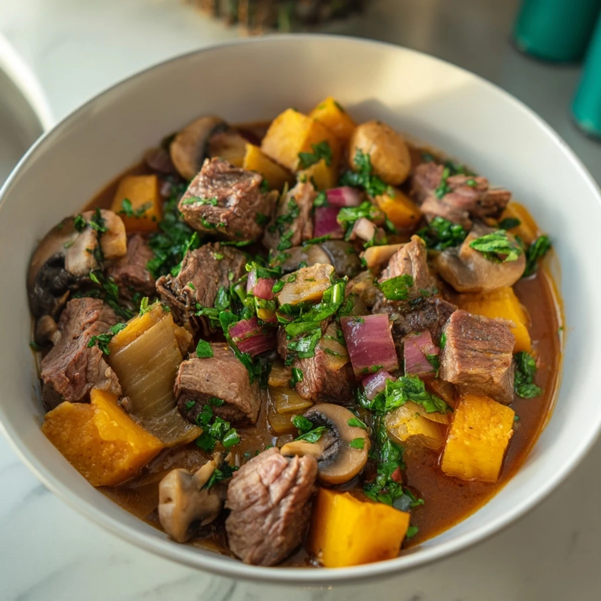 A steaming bowl of earthy beef stew with crusty bread, perfect for a cold evening meal.