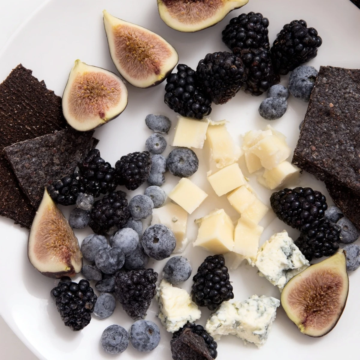 Imagine a Deep Indigo Midnight Sky cheese board; a stunning medley of dark fruits next to crumbled blue cheese.