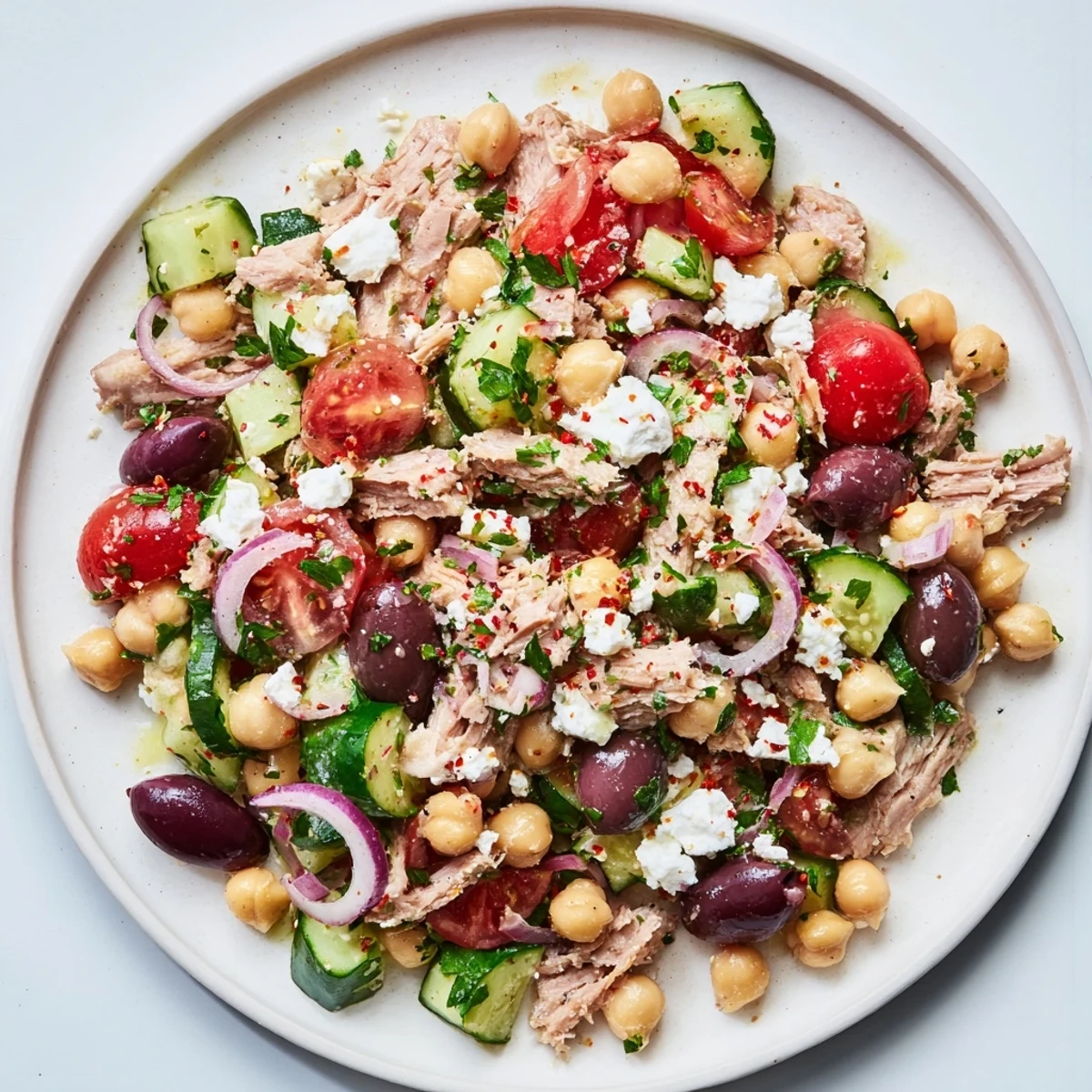 Fresh tuna chickpea salad: a colorful bowl with vibrant veggies and zesty dressing, perfect for lunch.