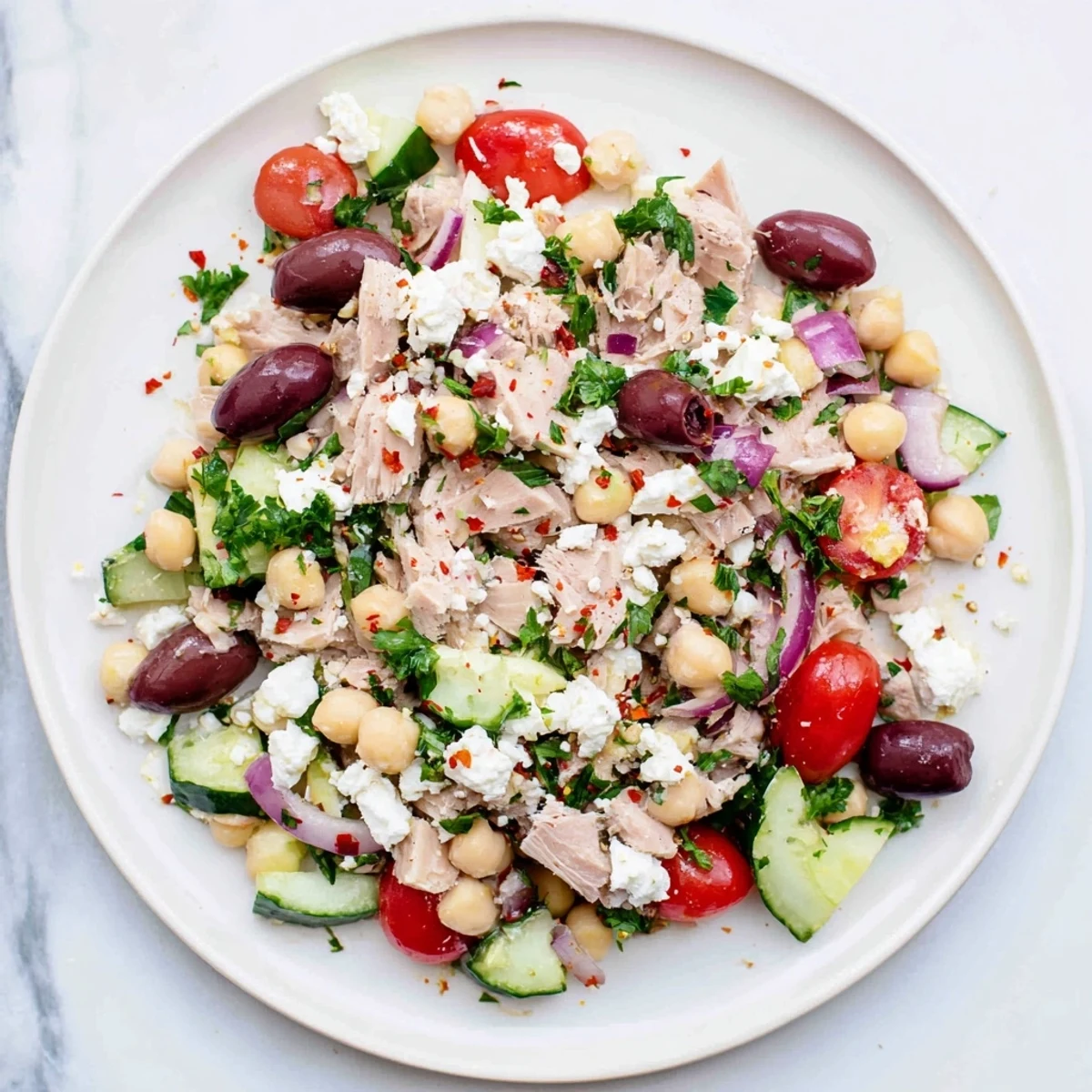 This healthy tuna chickpea salad features flaked tuna, mixed with creamy chickpeas and fresh parsley for lunch.