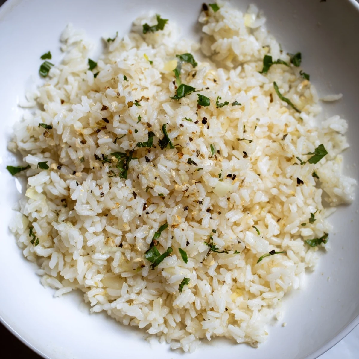Close-up of savory Garlic Butter Rice, cooked to perfection, ready to be served and enjoyed.
