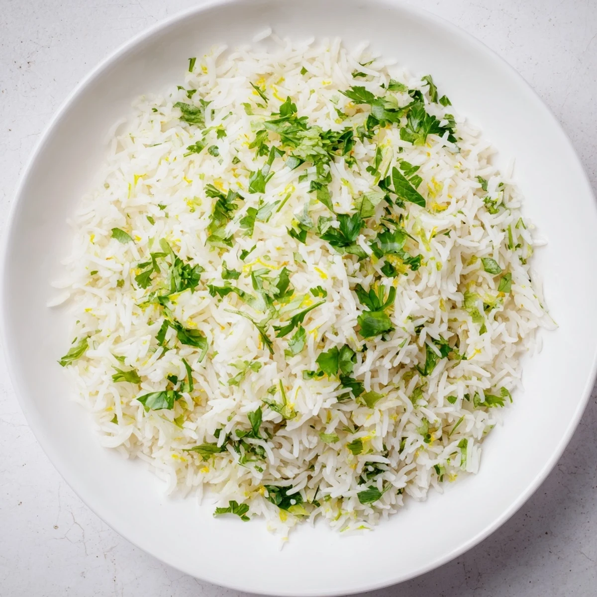 Fluffy white rice infused with cilantro, lime, and butter - this Cilantro Lime Rice is flavorful.