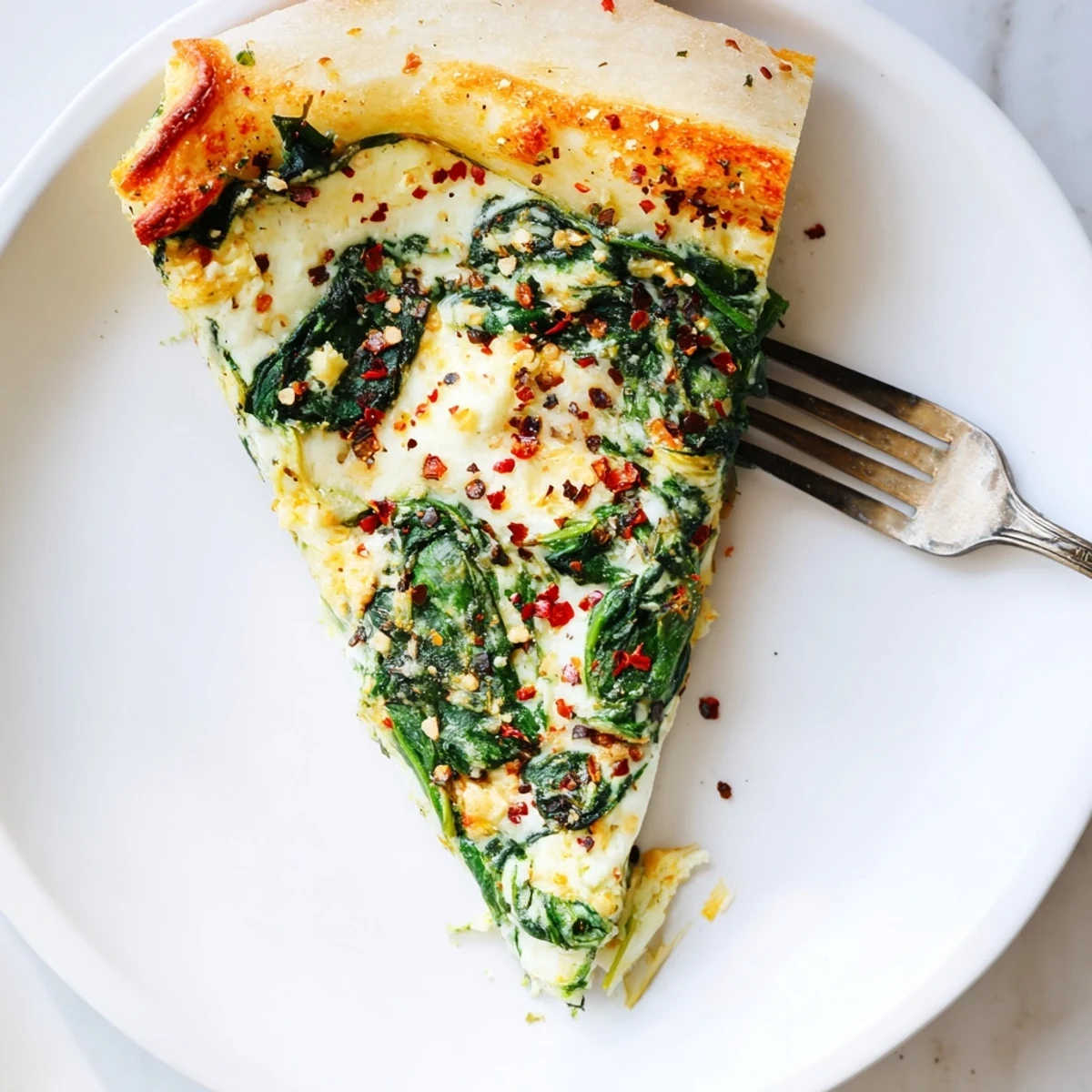 Golden-brown Spinach Ricotta Pizza fresh from the oven, topped with creamy ricotta, vibrant sautéed spinach, and a garlic butter glaze.