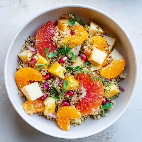Steaming Fresh Citrus & Avocado Quinoa Bowl with vibrant citrus segments and creamy avocado visible.
