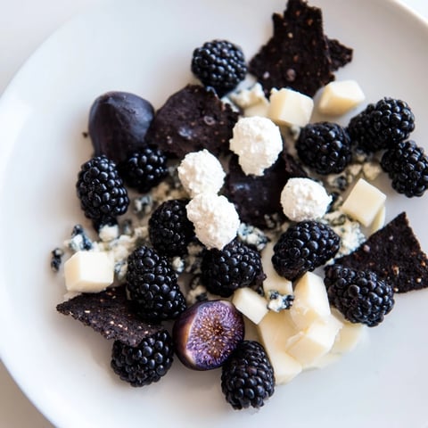 Deep Indigo Midnight Sky cheese board, showcasing ruby blackberries and creamy cheeses under starlit gold flakes.