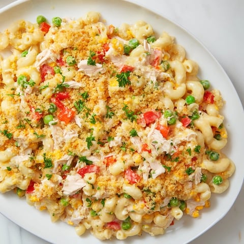 A bubbly casserole of Chicken Macaroni Southern Style with golden cheese topping.