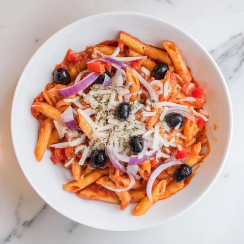 Close-up of bubbling One-Pot Pizza Pasta Express, loaded with melted mozzarella and pepperoni slices.