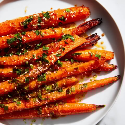 Golden-brown Maple Mustard Roasted Carrots, glistening from the sweet glaze, perfect side dish.