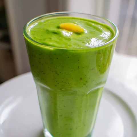 Spinach Avocado Smoothie, a vibrant green drink, ready to blend for a quick, healthy breakfast.