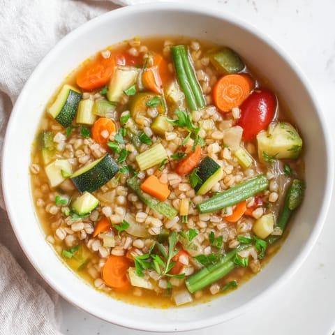 A warm bowl of Simple Homemade Grain and Vegetable Soup featuring a variety of wholesome ingredients.