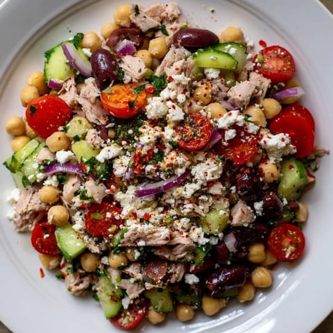 Close-up of the flavorful tuna chickpea salad, showcasing the texture and taste of each ingredient.