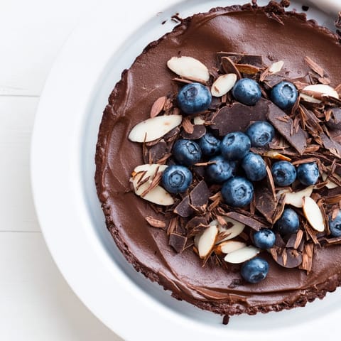 Creamy chocolate avocado mousse, blended smooth, served in glass bowls with shaved dark chocolate.