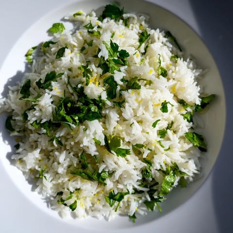 Bright green, fresh Cilantro Lime Rice, cooked to perfection, a perfect Mexican meal accompaniment.