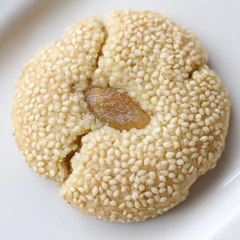 A close-up of beautifully decorated Palestinian Kahk cookies, freshly baked and ready to enjoy with coffee.