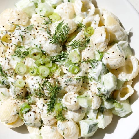 Everything bagel seasoning sprinkled over chilled pasta salad, perfect for picnics or summer potlucks.