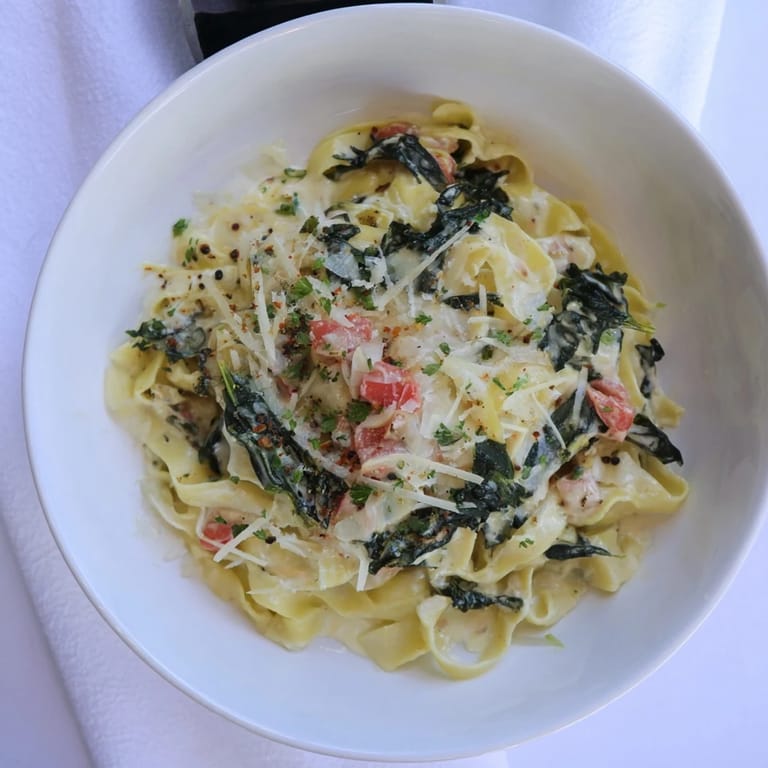 A beautiful serving of One-Pot Creamy Tuscan Garlic Herb Pasta, perfect for a vegetarian dinner.