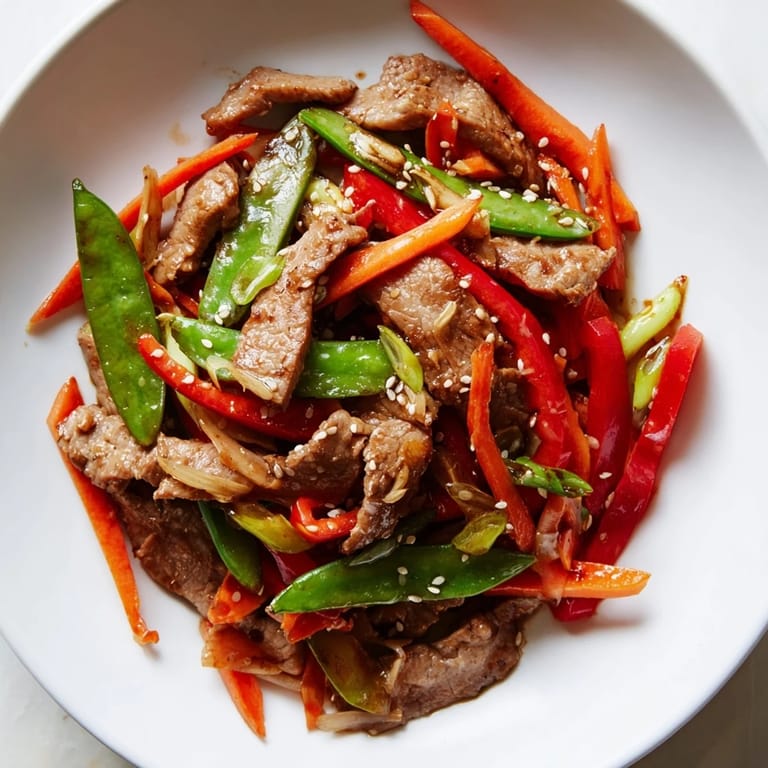 This sweet teriyaki pork stir-fry features vibrant vegetables and glistening sauce, ready to serve!