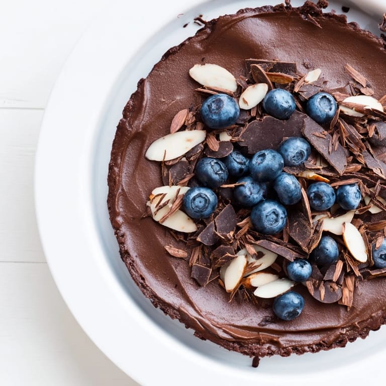 Creamy chocolate avocado mousse, blended smooth, served in glass bowls with shaved dark chocolate.