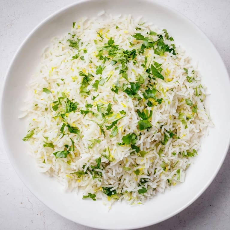 Fluffy white rice infused with cilantro, lime, and butter - this Cilantro Lime Rice is flavorful.