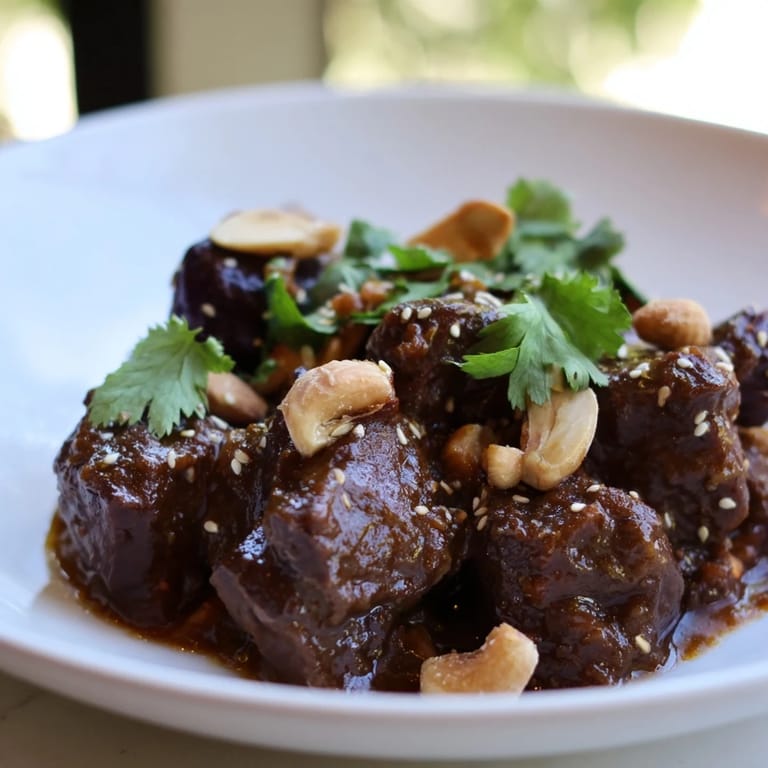 This Moroccan lamb tagine showcases slow-cooked lamb with prunes, almonds, and aromatic spices perfectly.