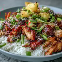Teriyaki Chicken and Rice Bowl with glazed chicken, fluffy rice, and stir-fried veggies.